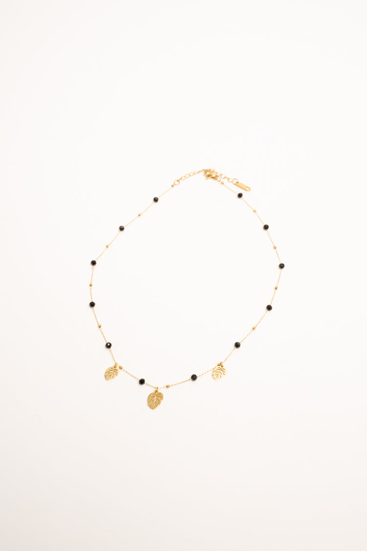 Golden leaf pendant and bead necklace