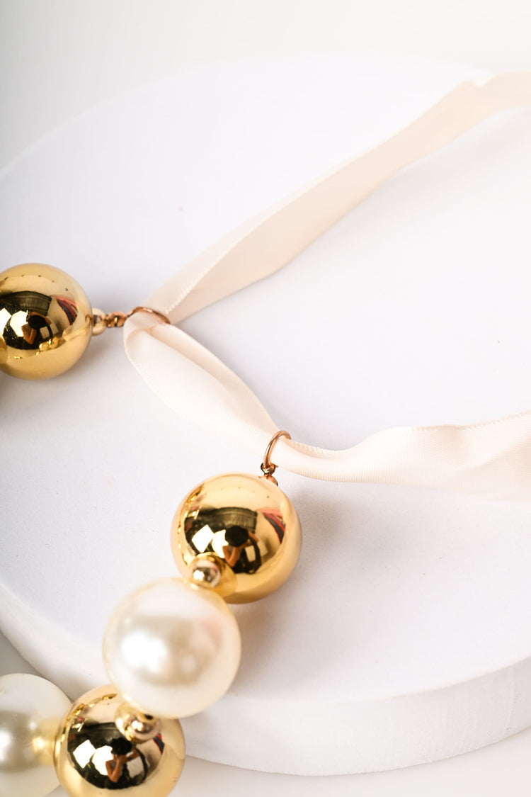 Pearls and self-tie strap chocker