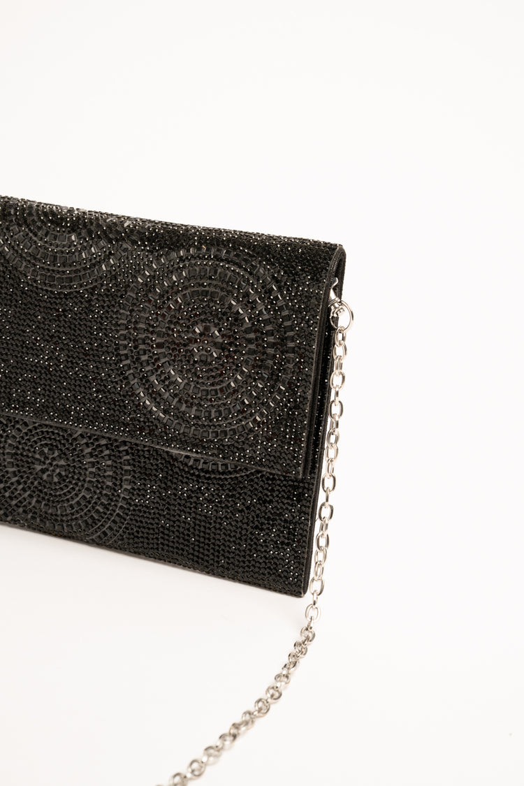 Black circle motif rhinestone clutch bag