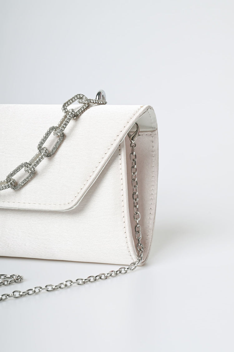 Jewel handle satin clutch bag