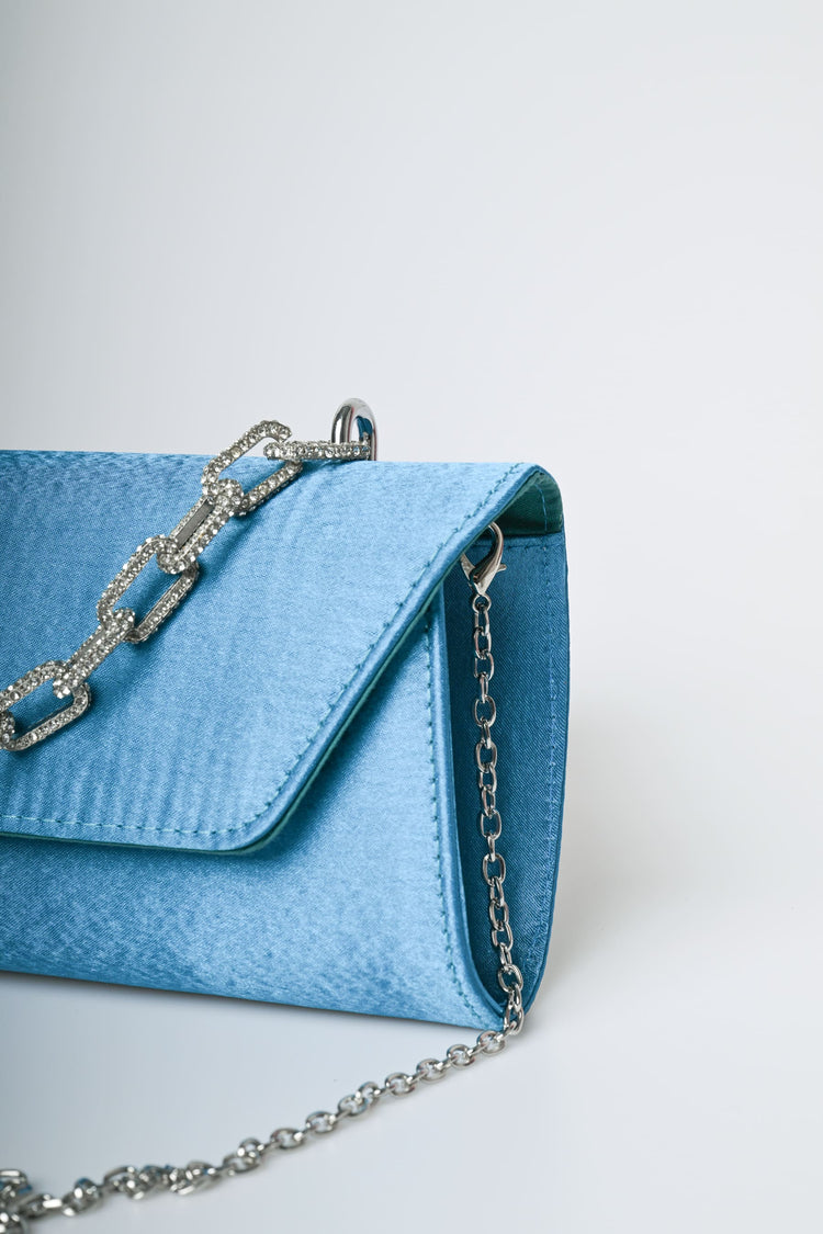 Jewel handle satin clutch bag