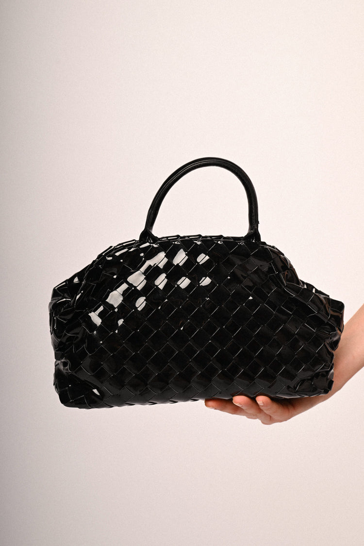 Black woven faux patent leather handbag