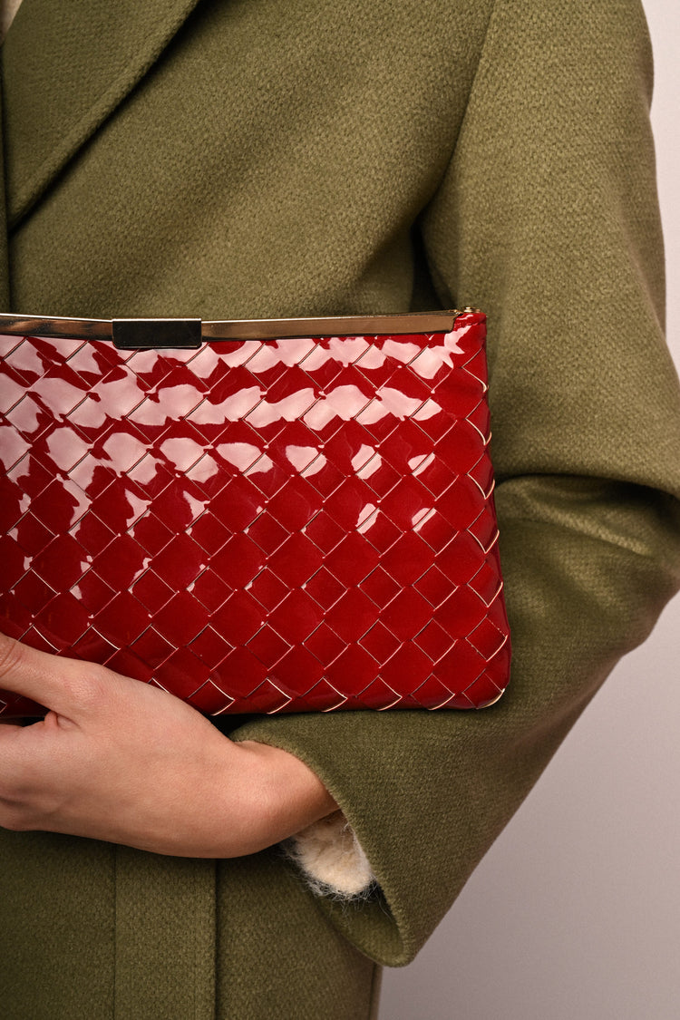 Woven faux patent leather clutch bag