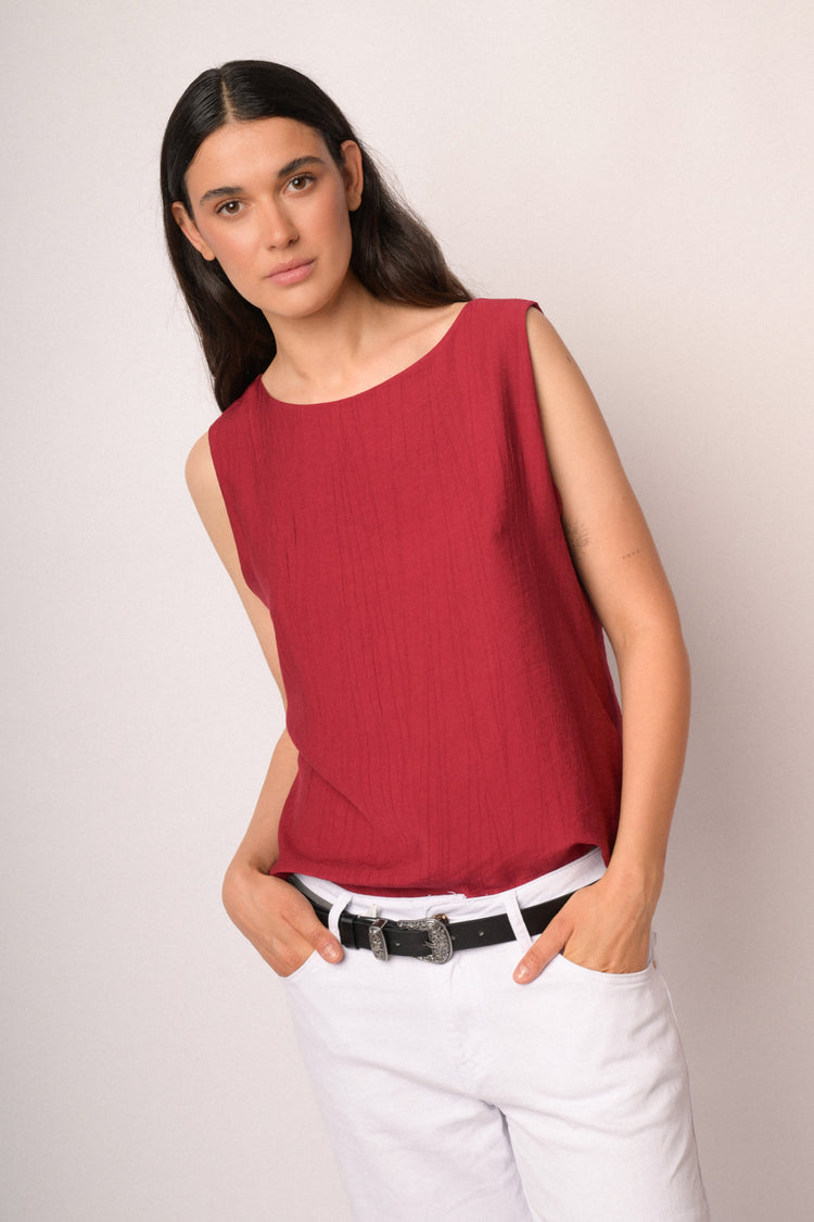 Red sleeveless top with boat neckline