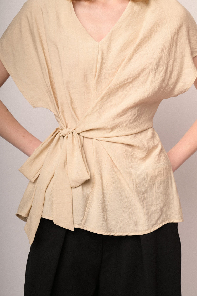 Beige V-neck and self-tie knot top